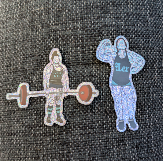 Two stickers on a textured surface, one with a person lifting weights and the other flexing muscles.